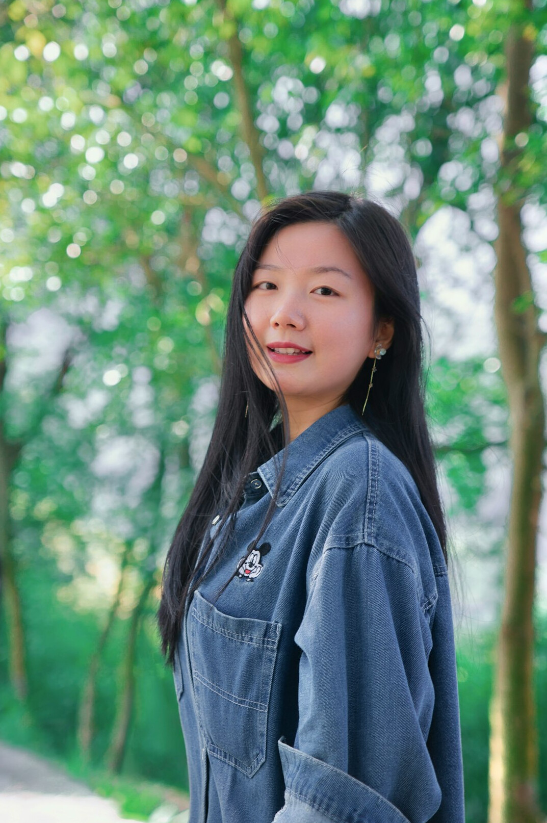 Portrait of a young woman with long hair smiling