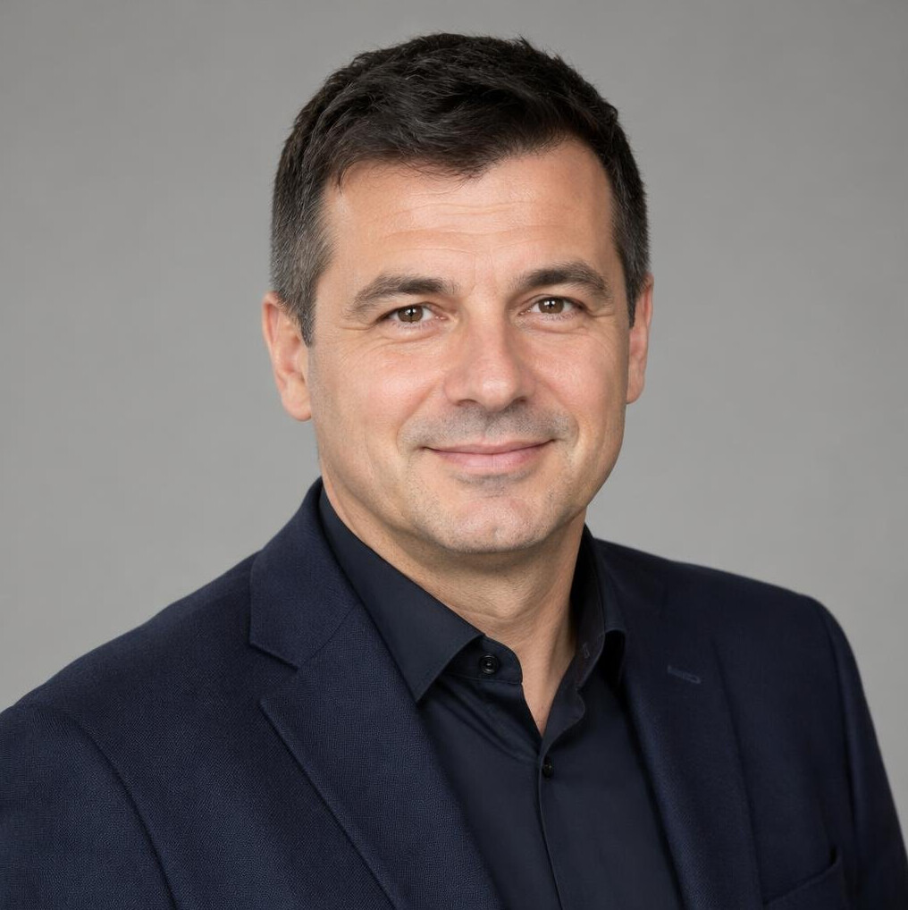Portrait of a man in a suit with a friendly expression